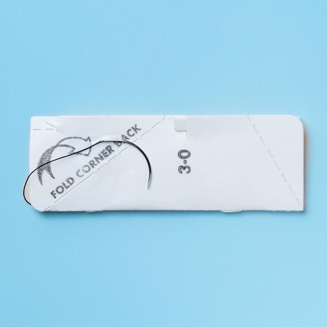 An image showing a box of 3-0 SILK black braided sutures with a 30-inch C-6 reverse cutting needle. The package, displaying reference number 768B, highlights the non-absorbable, black braided silk material and includes a QR code for immediate product details. Ideal for professionals in need of durable sutures for a range of surgical applications.