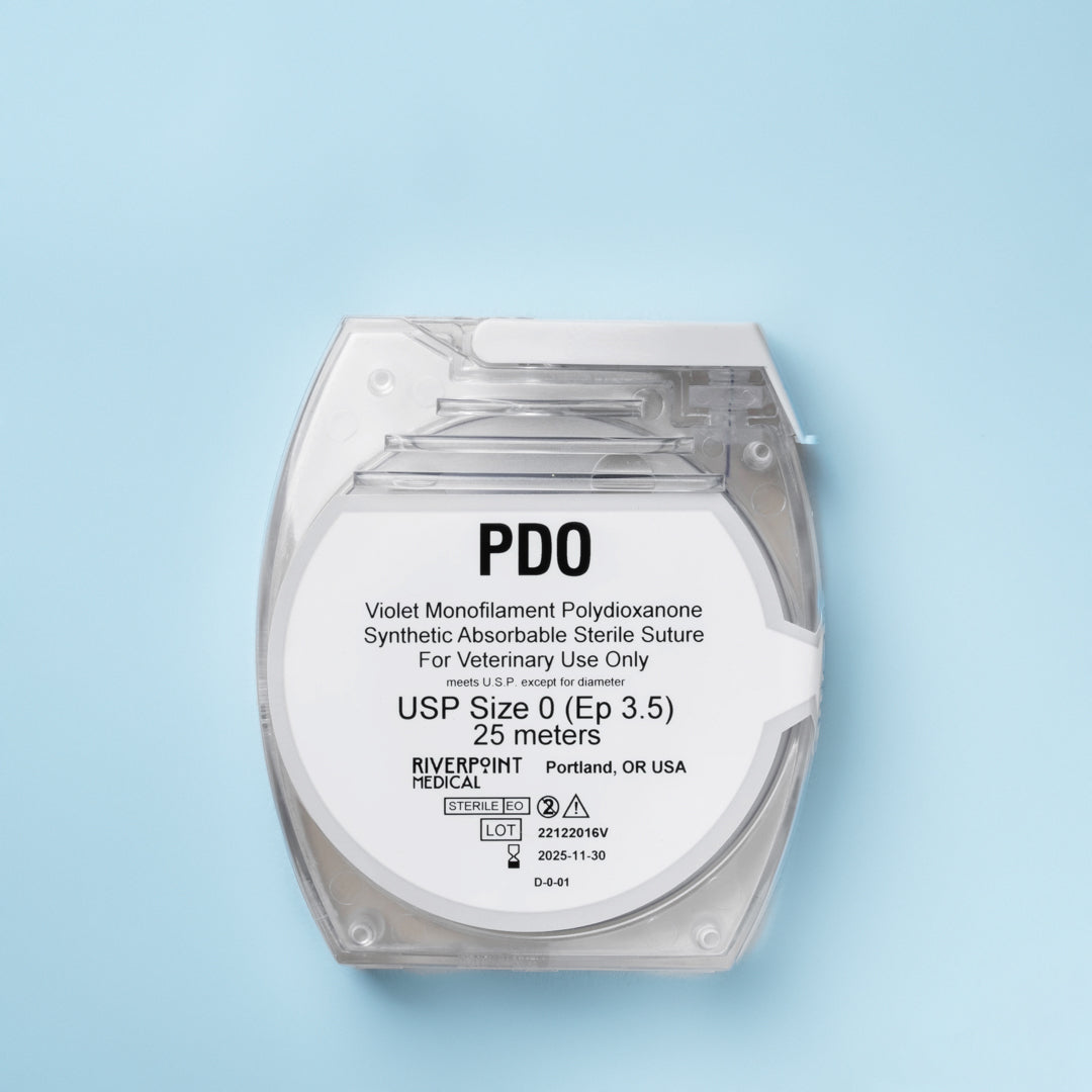 A clear package of PDO suture size 0 (Ep 3.5), showing a 25m violet monofilament thread made of polydioxanone for veterinary use. The label emphasizes its absorbable nature, extended wound support of 6 weeks, and compliance with USP & EP standards. Manufactured by RIVERPOINT in Portland, OR, USA, highlighting its premium quality and suitability for various surgical applications.
