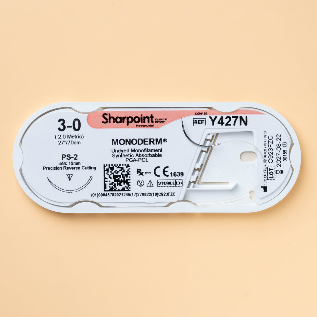 A Sharpoint Monoderm box labeled Y427N, containing 3-0 gauge, 27-inch length PGA-PCL monofilament sutures with a PS-2 precision reverse cutting needle. The packaging highlights the suture's absorbable nature, designed for delicate surgical applications where minimal tissue trauma and secure wound closure are essential. Manufactured by Surgical Specialties for professional use, ensuring sterility and reliability