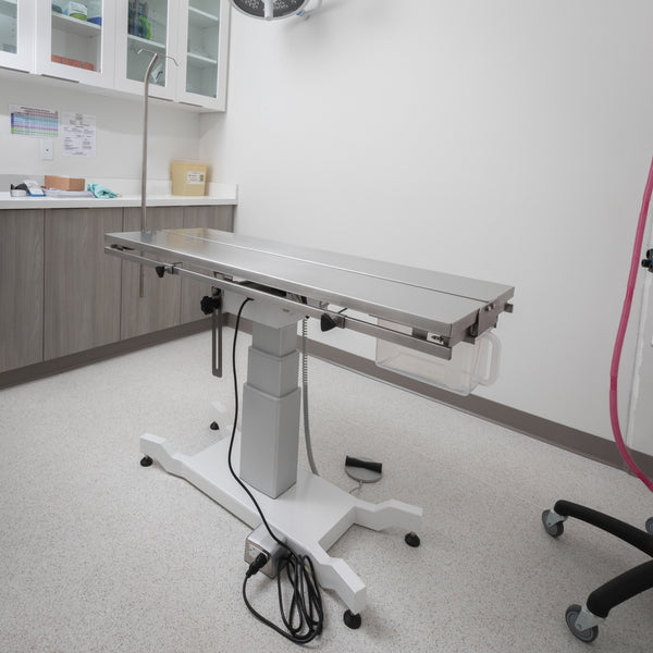 FT-886 universal veterinary operating table with an adjustable V-top for animal surgery and positioning.