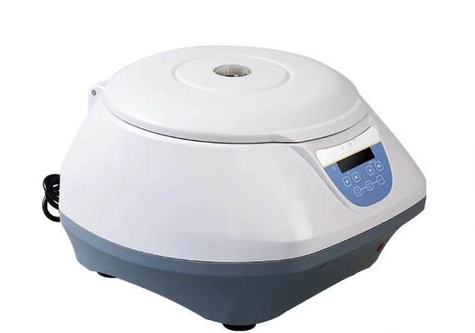 Benchtop blood centrifuge for clinical and veterinary laboratory sample separation.