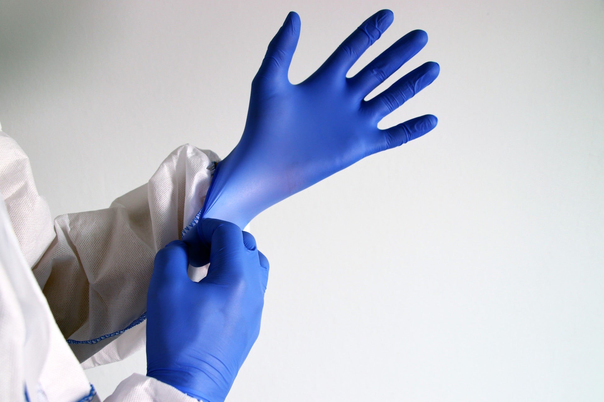 wearing medical gloves