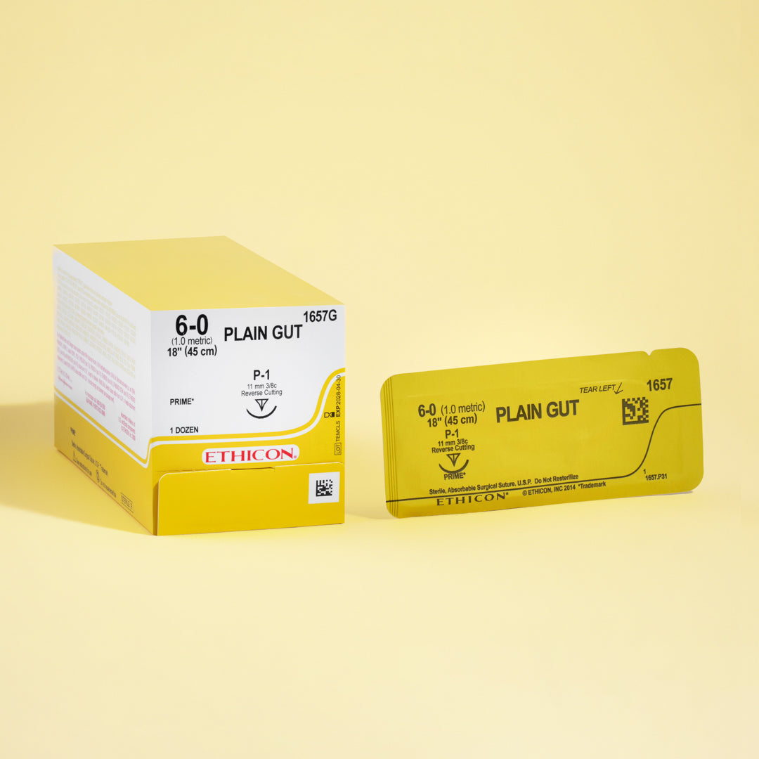 Box of 6-0 Plain Gut sutures, reference 1657G, showcasing the delicate, natural sutures equipped with a small 11mm P-1 reverse cutting needle for microsurgical precision. The bright yellow packaging indicates the specialized use of these sutures in procedures that require quick healing and minimal tissue disturbance