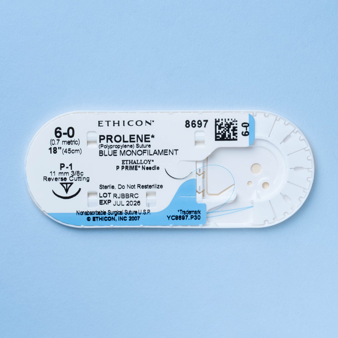 Box of PROLENE® 6-0 Blue Polypropylene Sutures, model 8697G, featuring ultra-fine sutures equipped with an 11mm P-1 ultra-precision reverse cutting needle, designed for the most delicate surgical applications, ensuring optimal outcomes with minimal tissue disturbance.