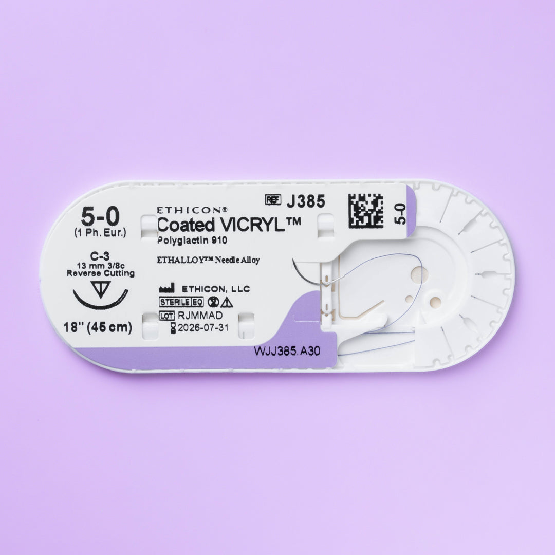 Box of COATED VICRYL® 5-0 Violet Sutures, model J385H, showcasing the distinct violet-colored threads attached to a sharp 13mm C-3 reverse cutting needle, designed for precise tissue approximation in surgeries requiring high visibility and minimal tissue reaction, packaged in quantities of 36 to accommodate extensive surgical needs.