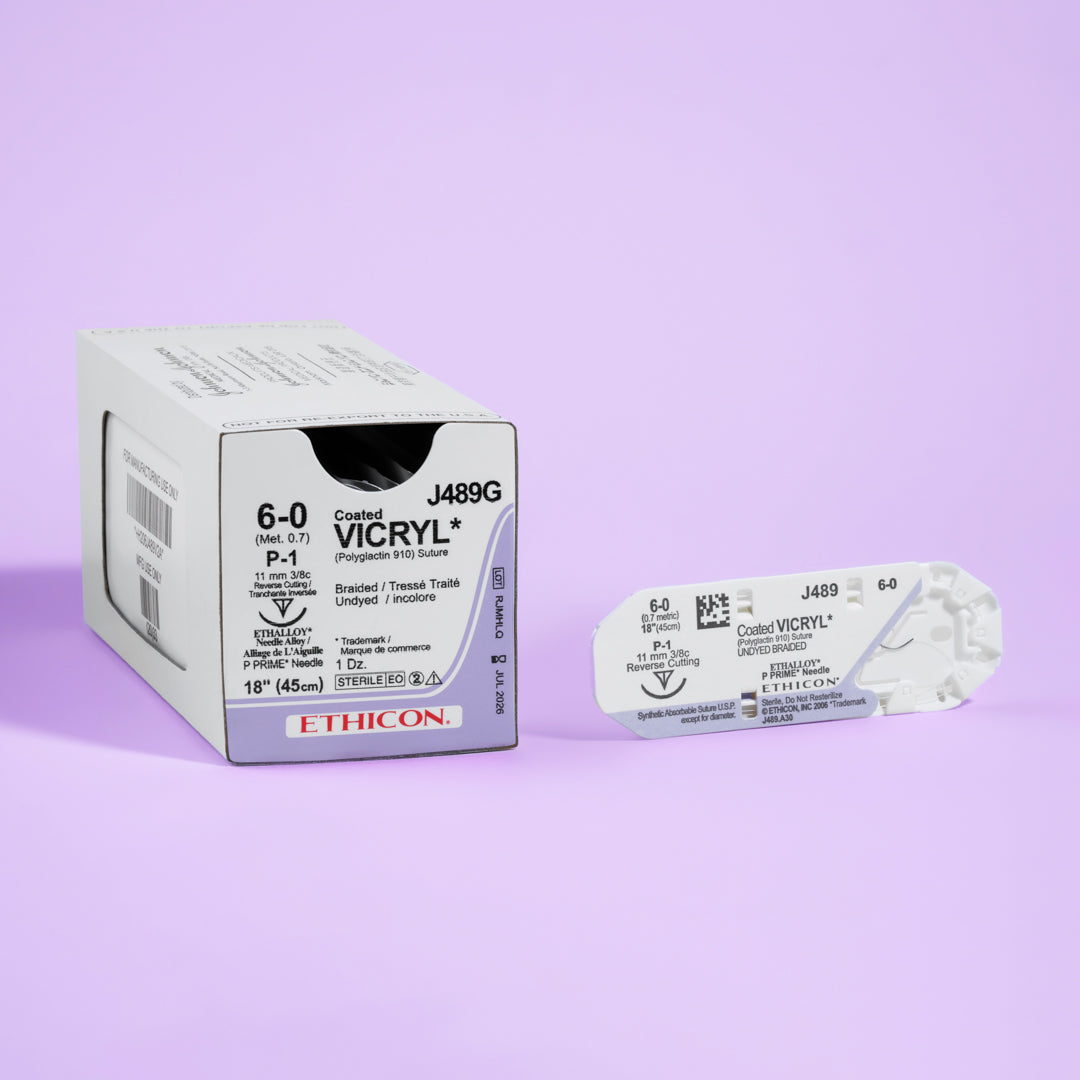 Box of COATED VICRYL® 6-0 Undyed Sutures, model J489G, featuring fine sutures with an 11mm P-1 prime reverse cutting needle, tailored for precision in delicate surgical contexts. The packaging highlights the absorbable nature and surgical versatility of these sutures, ideal for enhancing patient outcomes.