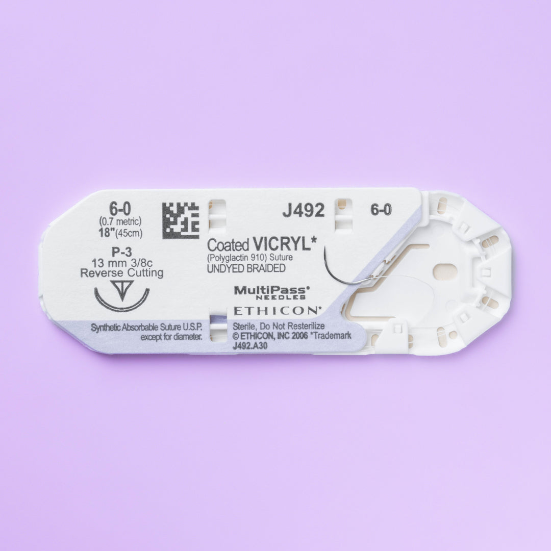 Box of COATED VICRYL® 6-0 Undyed Sutures, model J492G, showcasing fine sutures with a 13mm P-3 prime reverse cutting needle, optimized for precision in delicate surgical procedures. The packaging emphasizes the suture's absorbable qualities and its role in promoting seamless healing and patient comfort.