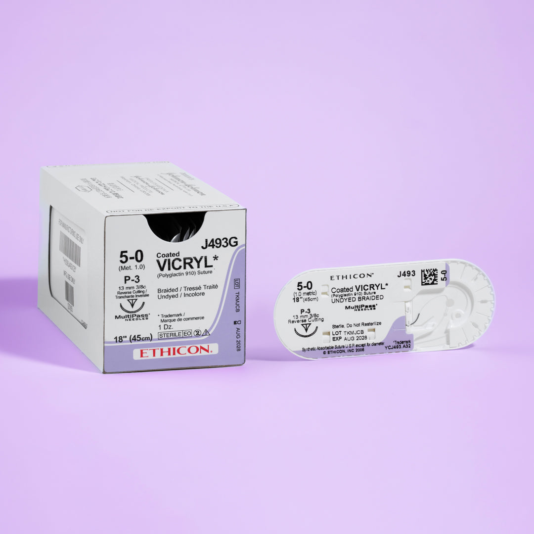 Close-up of COATED VICRYL® 5-0 Undyed Sutures, model J493G, featuring sutures with a 13mm P-3 prime reverse cutting needle. The packaging highlights the suture's advanced design for delicate surgical applications, emphasizing its absorbable nature and commitment to promoting effective and comfortable patient recovery.