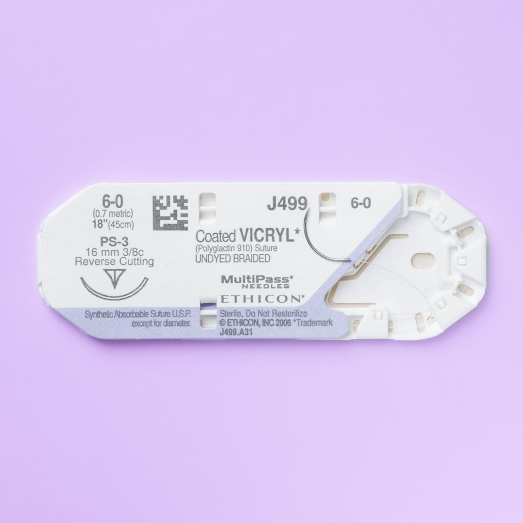 COATED VICRYL® 6-0 undyed suture, model J499G, with 18-inch length and PS-3 needle, packed in a box of 12 for surgical use. Highlighting its absorbable nature and specialized needle for precision in soft tissue approximation.