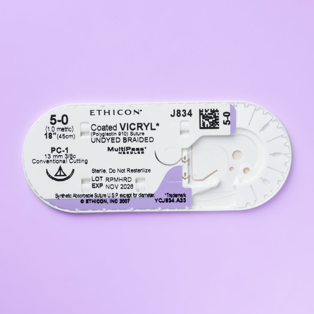Packaging of COATED VICRYL® 5-0 undyed sutures, model J834G, showcasing the 13mm PC-1 conventional cutting needle. Designed for a broad spectrum of surgical applications, these sutures are highlighted for their absorbable material and commitment to surgical excellence.