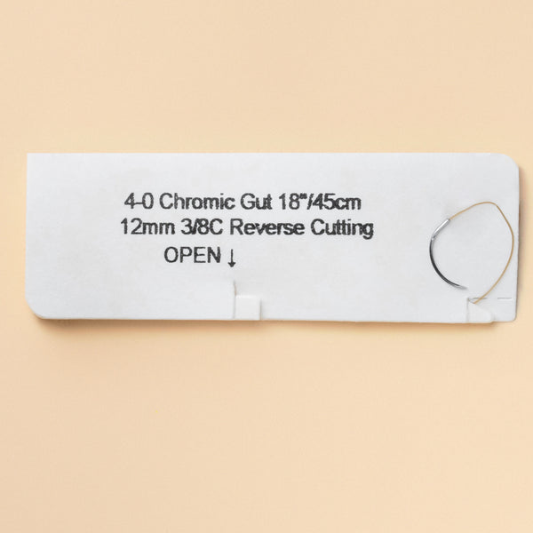 Box of 4-0 Chromic Gut sutures with a C-17 reverse cutting needle, model 546B, emphasizing the 2-week wound support duration and featuring a QR code for easy reference. The packaging highlights its sterility and absorbable nature tailored for effective wound management