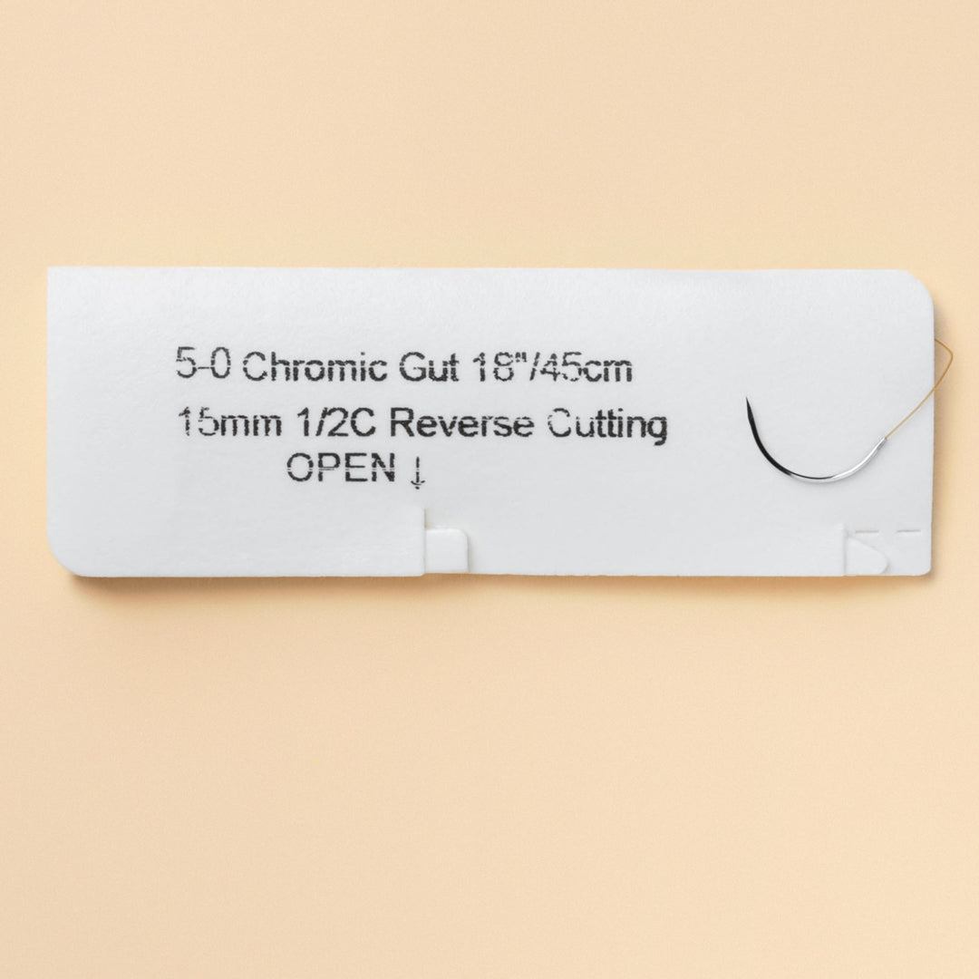 Box of 5-0 Chromic Gut sutures with a C-26 reverse cutting needle, reference 598B, highlighting 2-week wound support. The packaging is sterile, indicating the product’s readiness for medical procedures, with a QR code for product traceability.