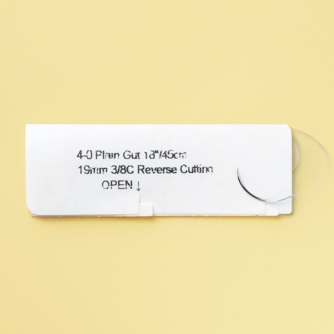 Box of 4-0 Plain Gut sutures with a C6 reverse cutting needle, reference number 591B, emphasizing the 1-week wound support with a QR code for easy access to information. The packaging confirms its sterile condition and the suture's quick absorption profile for effective wound care.