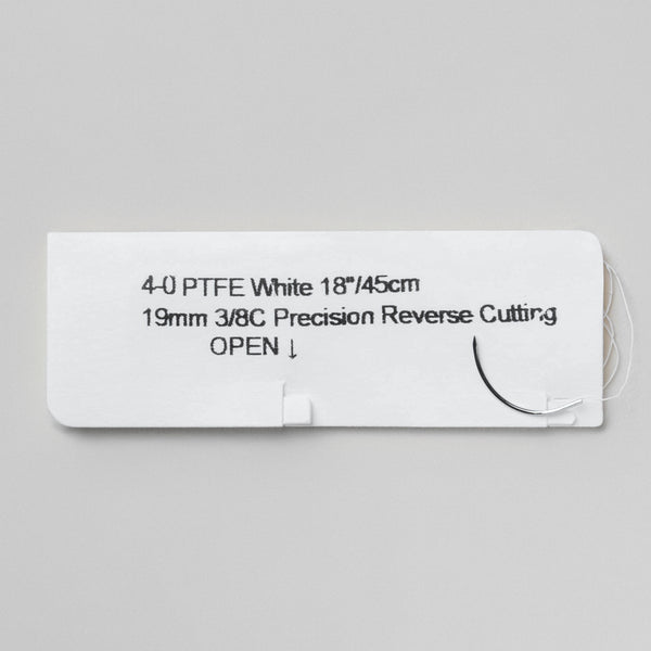 Image showing a box and individual package of 4-0 PTFE white sutures with an 18-inch PC-31 precision reverse cutting needle. The box is labeled with the reference number 821B, indicating the non-absorbable nature of the sutures, and includes a QR code for easy access to detailed product information. The sutures are designed for use in periodontal and dental surgery where prolonged suture support is required.
