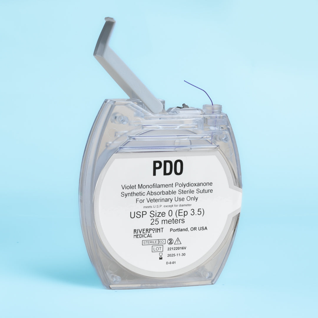 A clear package of PDO suture size 0 (Ep 3.5), showing a 25m violet monofilament thread made of polydioxanone for veterinary use. The label emphasizes its absorbable nature, extended wound support of 6 weeks, and compliance with USP &amp; EP standards. Manufactured by RIVERPOINT in Portland, OR, USA, highlighting its premium quality and suitability for various surgical applications.