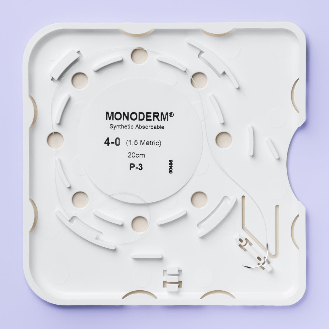 Quill Monoderm VLM-3001 4-0 suture box, white with orange and purple accents, marking 20cm suture length and 13mm P-3 precision reverse cutting needle. Sutures are PGA-PCL monofilament, absorbable, with a 3-week wound support time, EO sterilized.