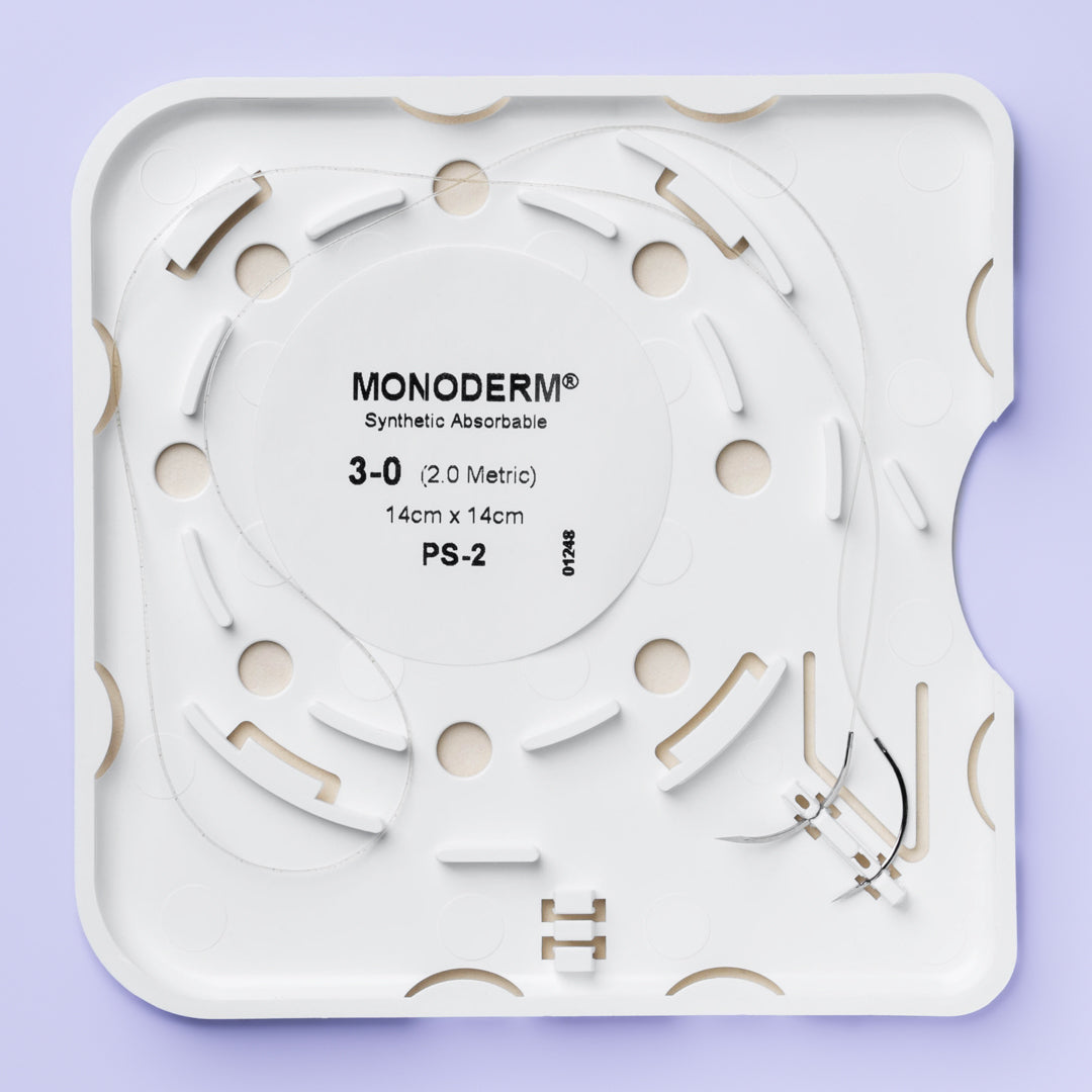 The image displays a box of Quill Monoderm 3-0 sutures, underscoring their advanced bi-directional barbed technology for precise wound closure. The suture is indicated for delicate tissue repair, with a 19mm precision reverse cutting needle for minimal tissue trauma. The packaging highlights important information such as the suture and needle size, the length of the suture, lot number, sterilization method, and regulatory compliance marks.