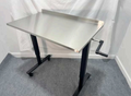 Over-the-patient instrument table with stainless steel top and manual hand crank height adjustment, rolls over any surgery table