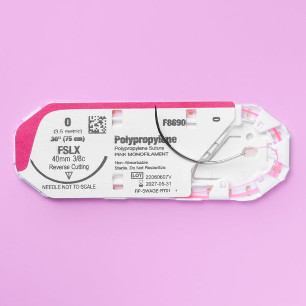 Detailed view of the 0 ViSIPRO™ Polypropylene Monofilament Suture with FSLX Needle (F8690) in sterile packaging, highlighting the pink monofilament suture and large reverse cutting needle, ready for complex veterinary surgeries.